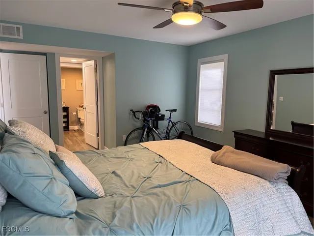 a bedroom with a bed and window