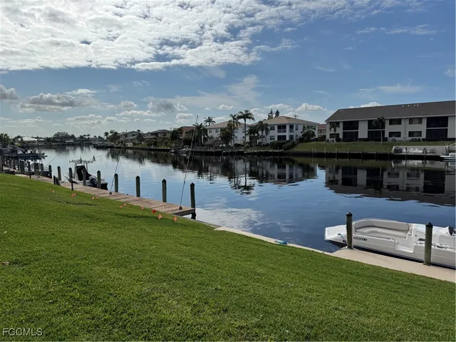 a view of a lake with houses in the background