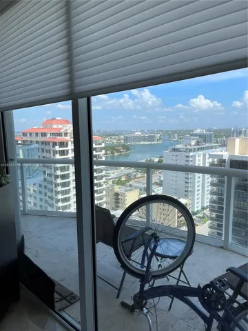 a view of a room with furniture and a fireplace