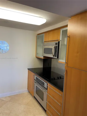 a kitchen with a stove and a microwave