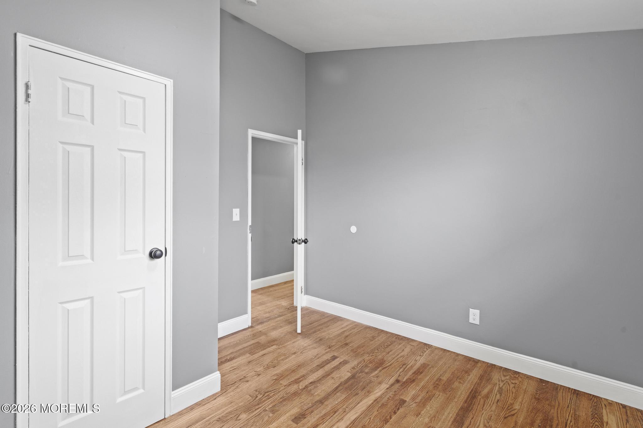 20 Kenneth Terrace Neptune Township, NJ 07753 - Photo 11 of 34 a view of an empty room and wooden floor