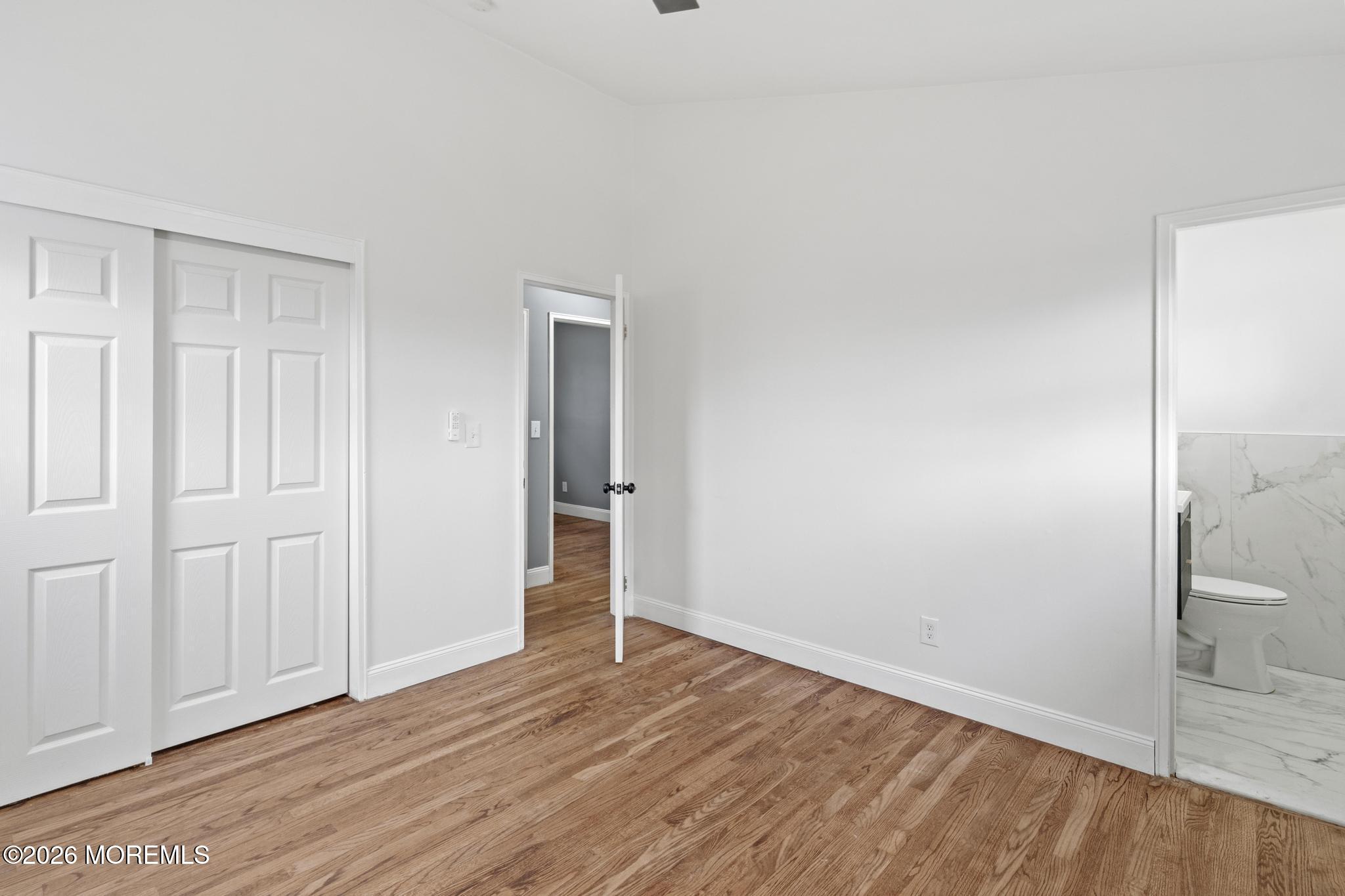 20 Kenneth Terrace Neptune Township, NJ 07753 - Photo 15 of 34 wooden floor in an empty room