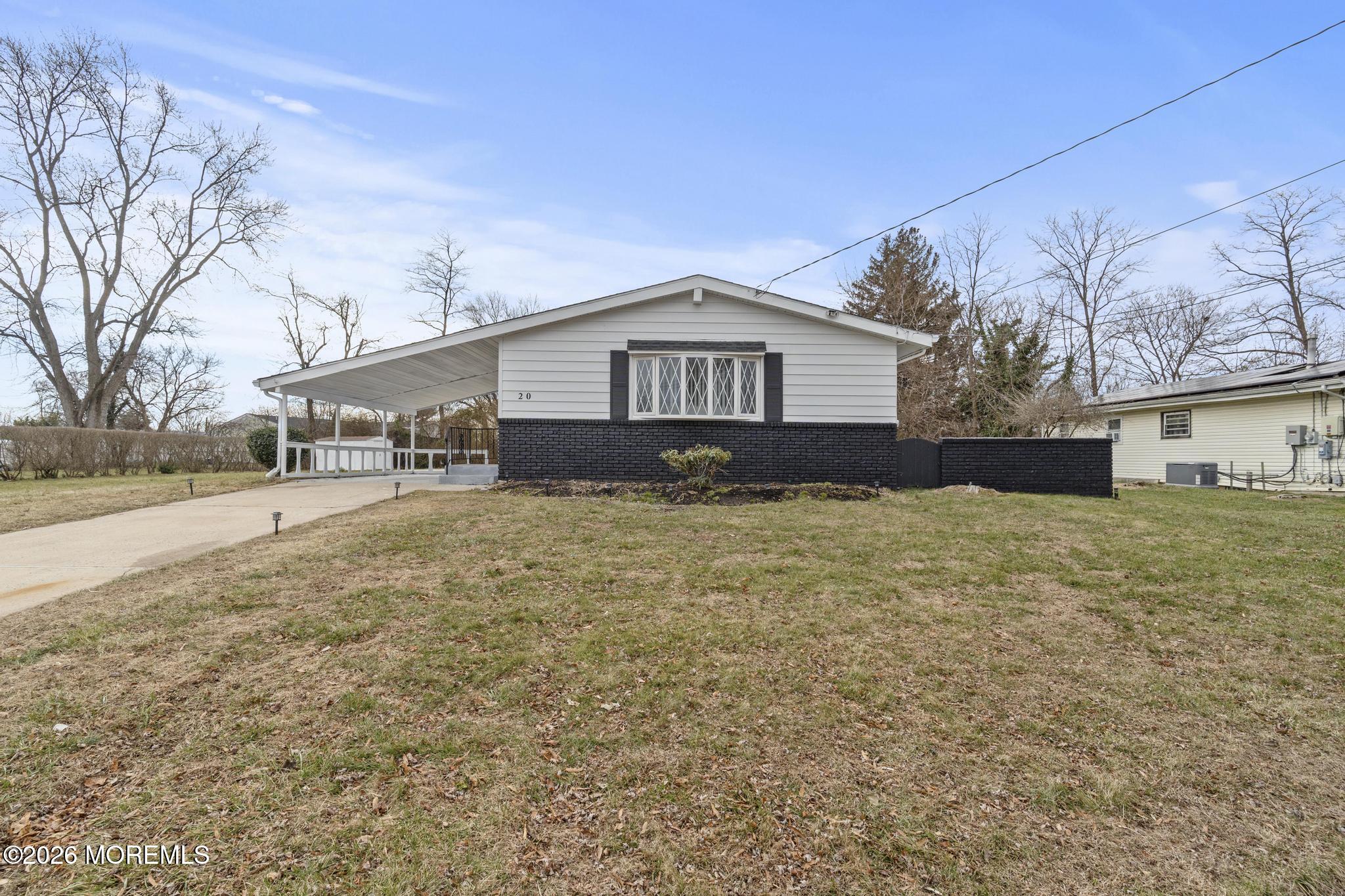 20 Kenneth Terrace Neptune Township, NJ 07753 - Photo 17 of 34 a front view of a house with a yard
