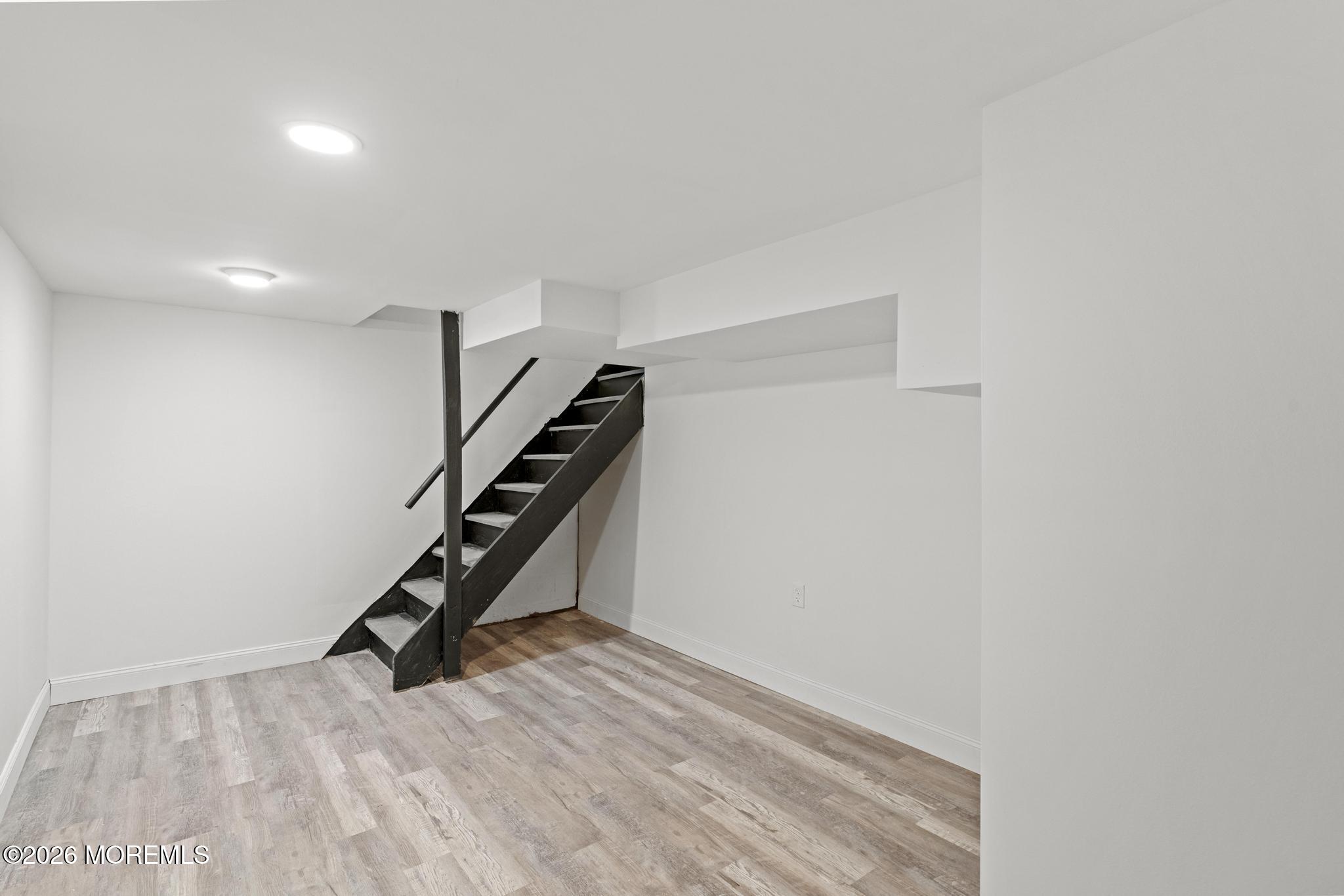 20 Kenneth Terrace Neptune Township, NJ 07753 - Photo 26 of 34 a view of an empty room with stairs