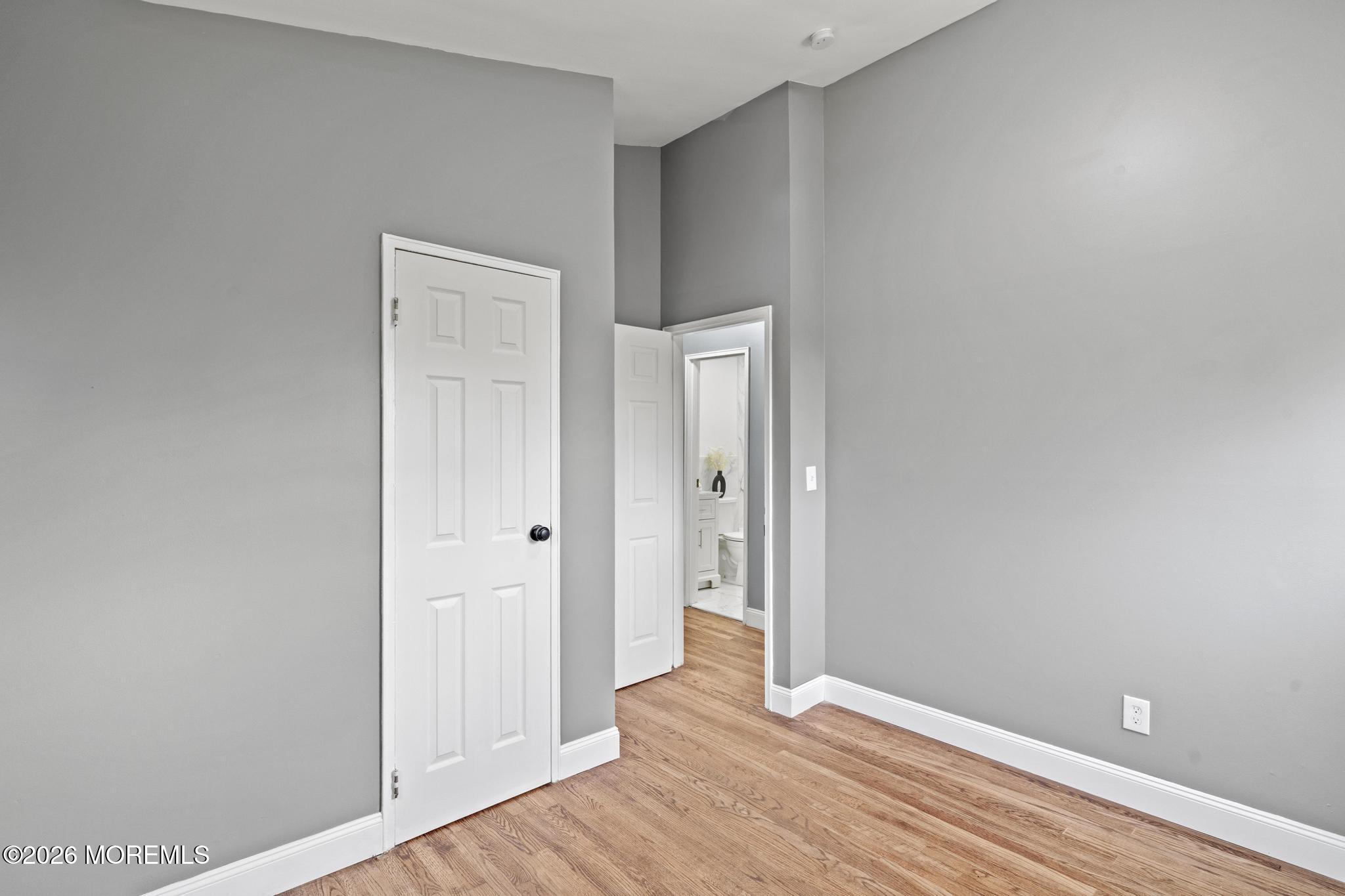 20 Kenneth Terrace Neptune Township, NJ 07753 - Photo 28 of 34 a view of an empty room with wooden floor