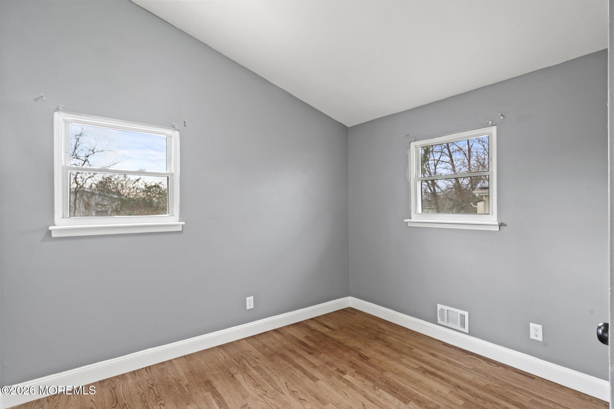 20 Kenneth Terrace Neptune Township, NJ 07753 - Photo 29 of 34 a view of room with window and wooden floor