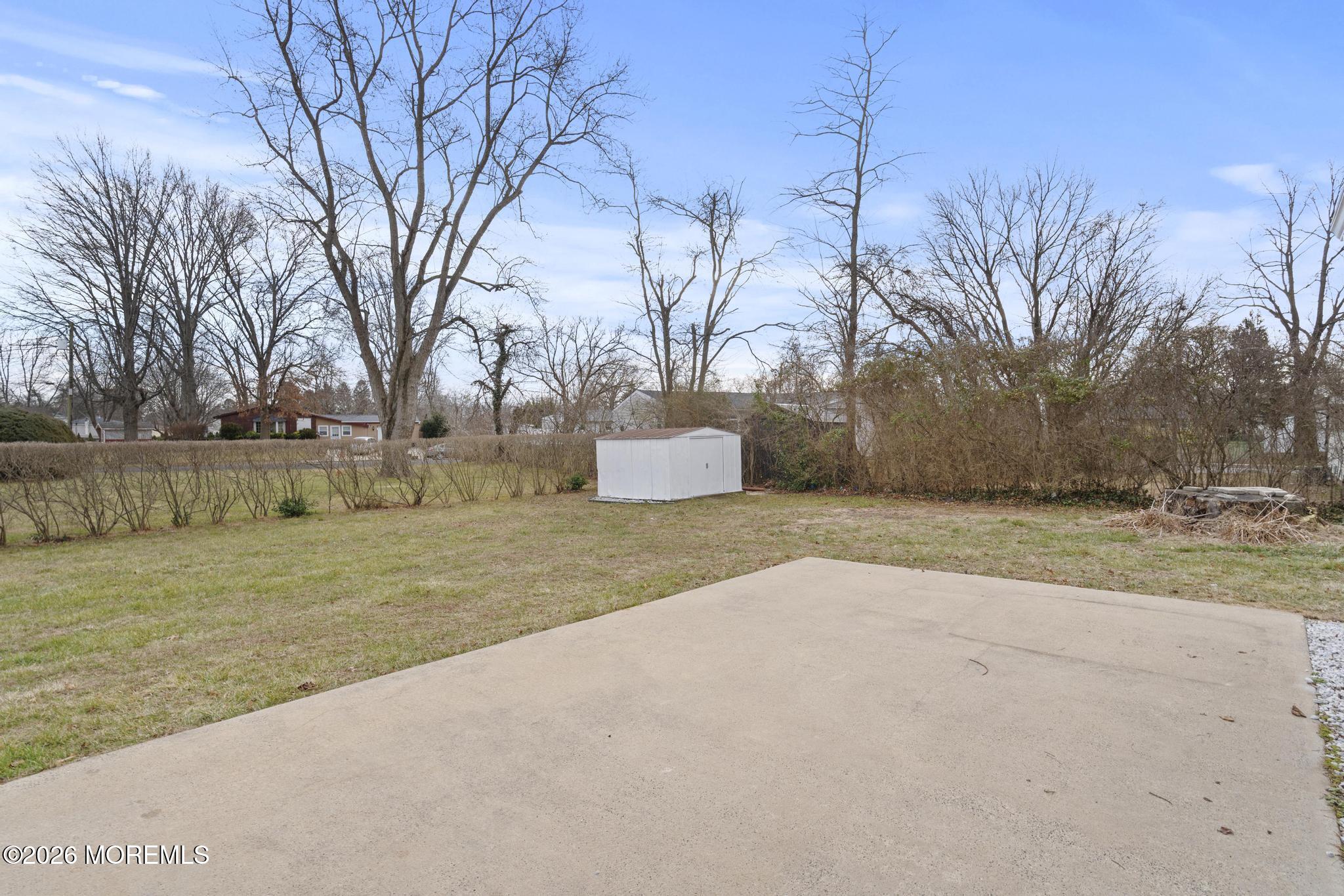 20 Kenneth Terrace Neptune Township, NJ 07753 - Photo 31 of 34 a wooden bench sitting in middle of a field