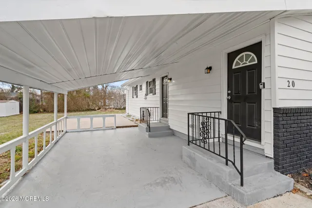 a view of an empty room with windows