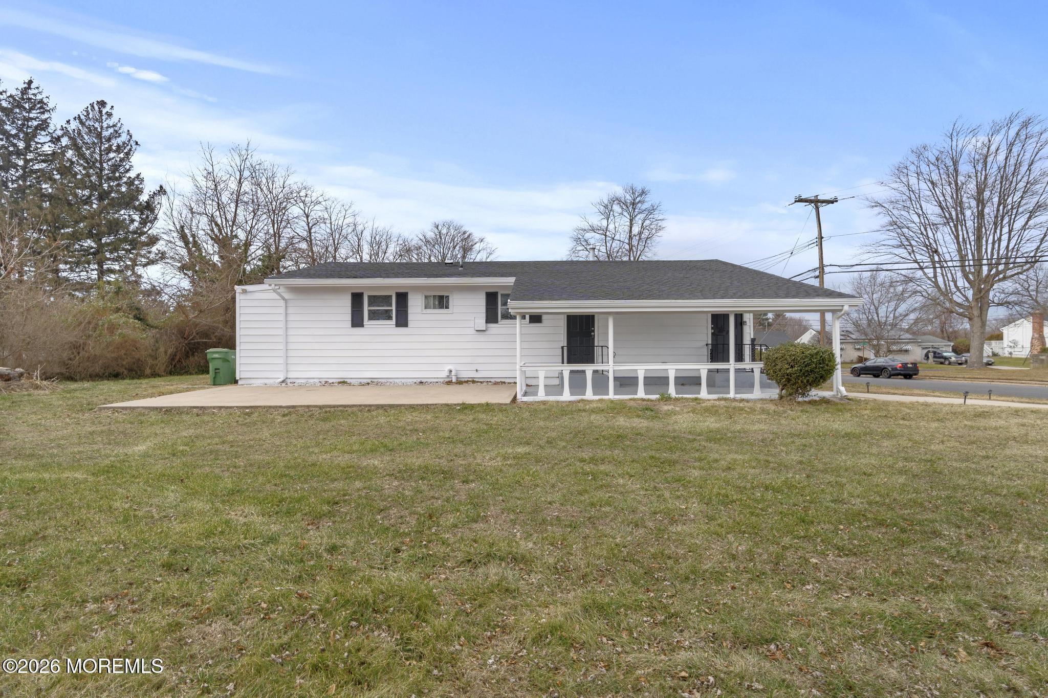 20 Kenneth Terrace Neptune Township, NJ 07753 - Photo 32 of 34 a front view of house with yard and trees around