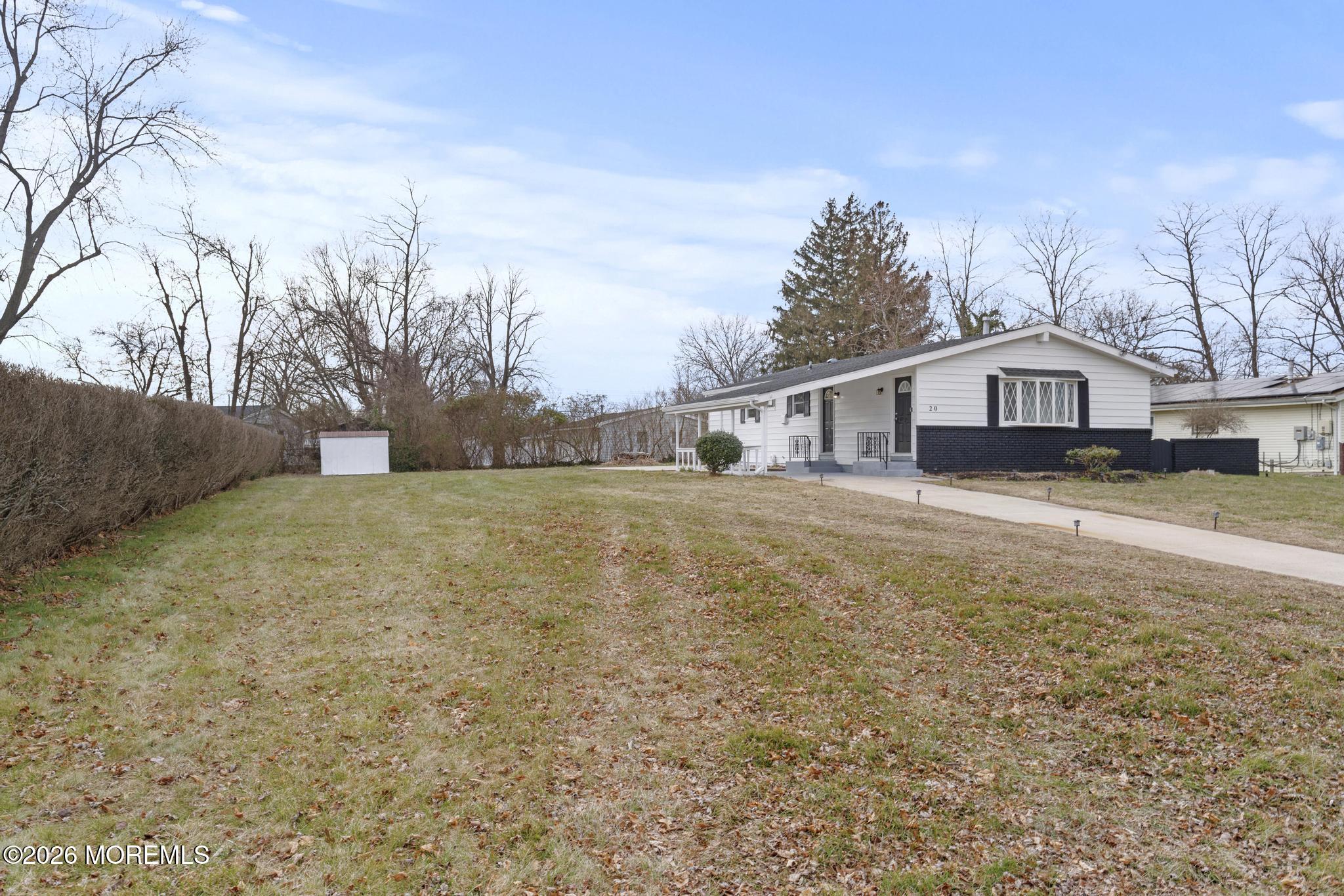 20 Kenneth Terrace Neptune Township, NJ 07753 - Photo 34 of 34 a front view of a house with a yard