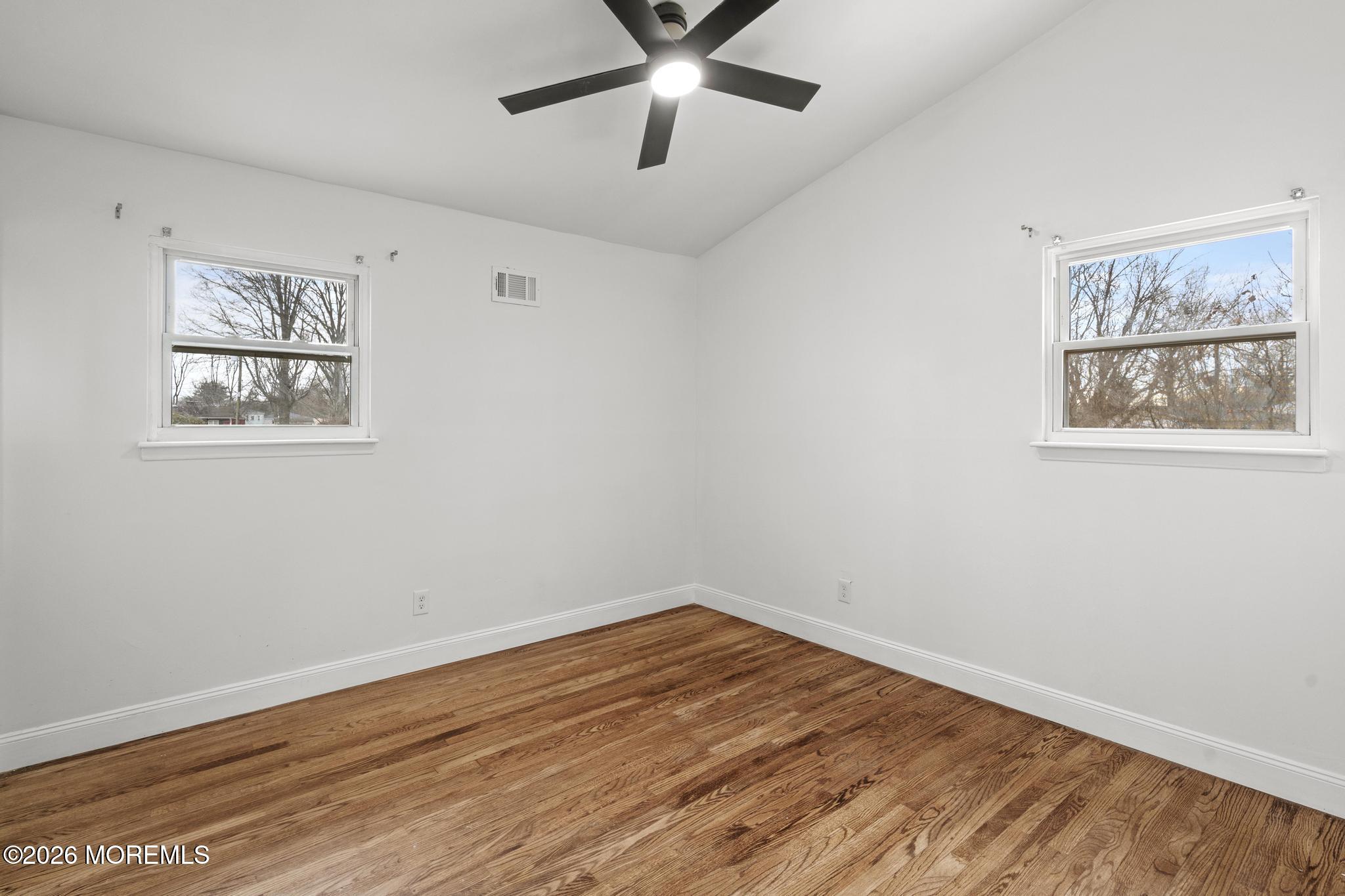 20 Kenneth Terrace Neptune Township, NJ 07753 - Photo 9 of 34 a view of empty room with wooden floor