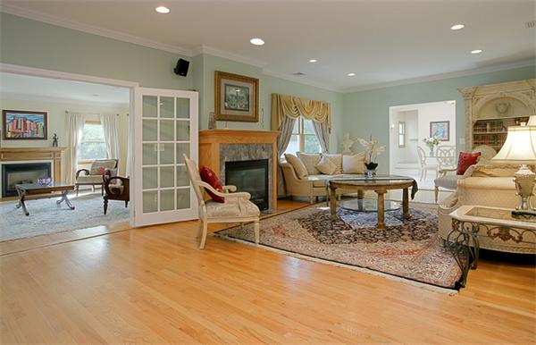 65 Indian Ridge Road Newton, MA 02459 - Photo 1 of 9 a living room with furniture a fireplace and a table