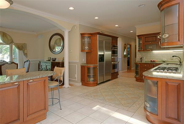 65 Indian Ridge Road Newton, MA 02459 - Photo 3 of 9 a kitchen with stainless steel appliances granite countertop a stove and a refrigerator