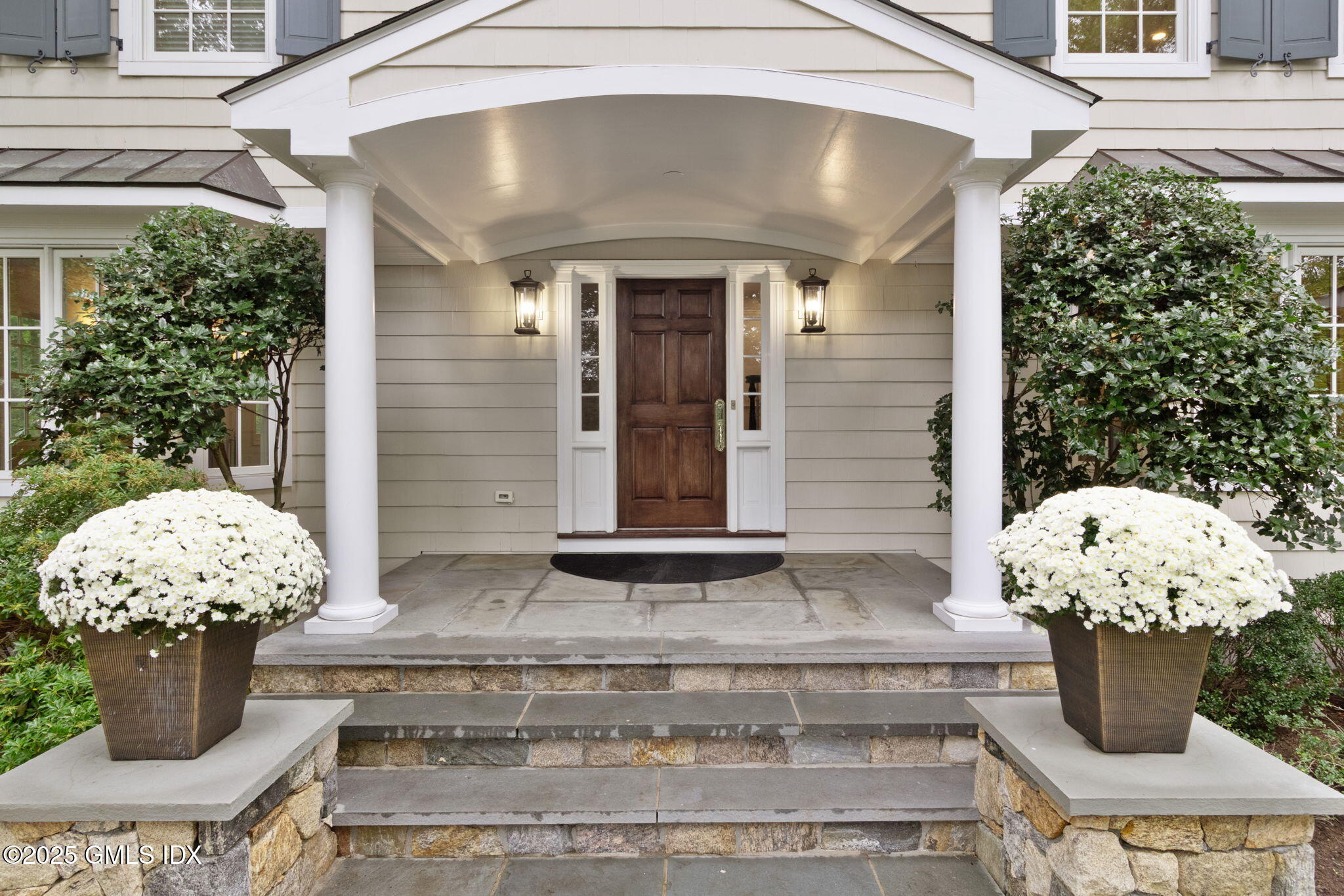 44 Indian Head Road Riverside, CT 06878 - Photo 4 of 55 a front view of a house with a fountain