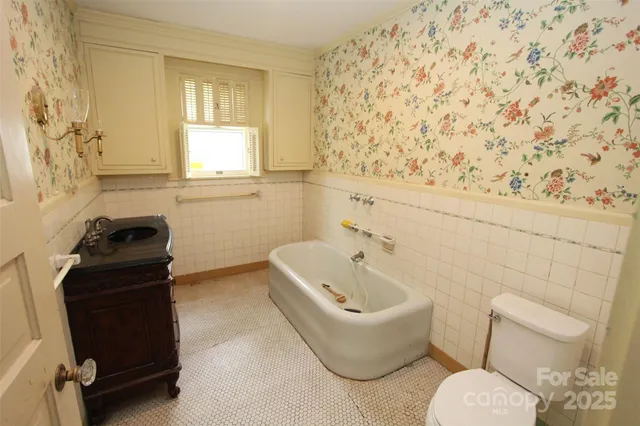 a bathroom with a toilet and a sink