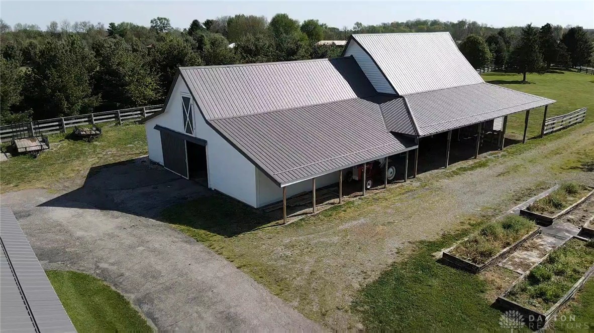 3489 Harlan-Carroll Road Waynesville, OH 45068 - Photo 88 of 98 This spacious barn offers ample storage and versatile functionality amidst picturesque surroundings.