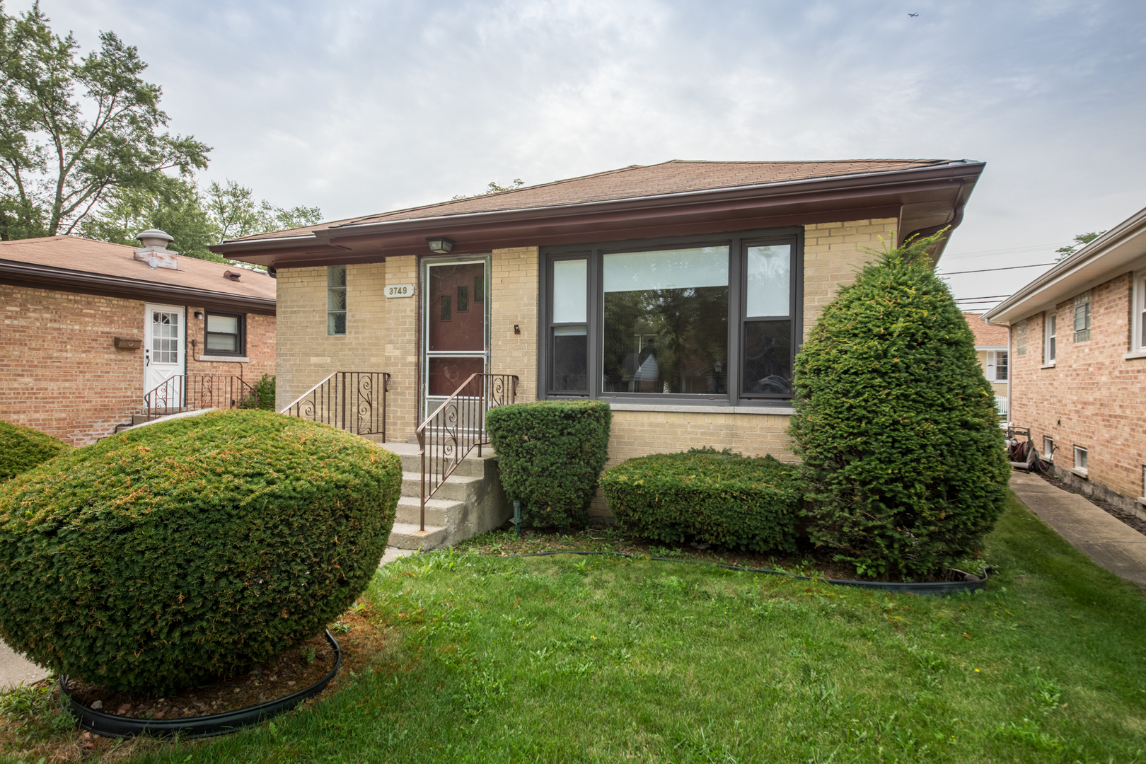 3749 Main Street Skokie, IL 60076 - Photo 1 of 17 front view of a house with a garden