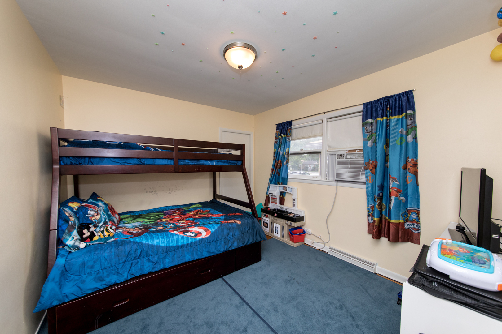 3749 Main Street Skokie, IL 60076 - Photo 12 of 17 a bed room with furniture and a flat screen tv