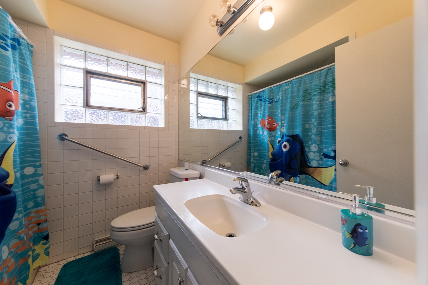3749 Main Street Skokie, IL 60076 - Photo 13 of 17 a bathroom with a sink toilet and tub