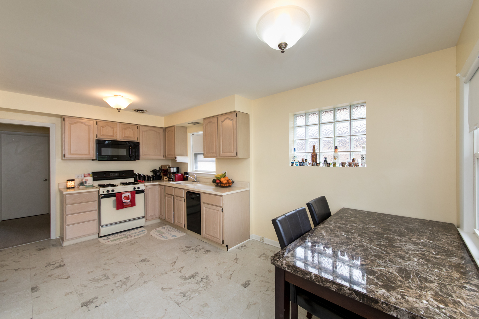 3749 Main Street Skokie, IL 60076 - Photo 6 of 17 a kitchen with a stove and a refrigerator