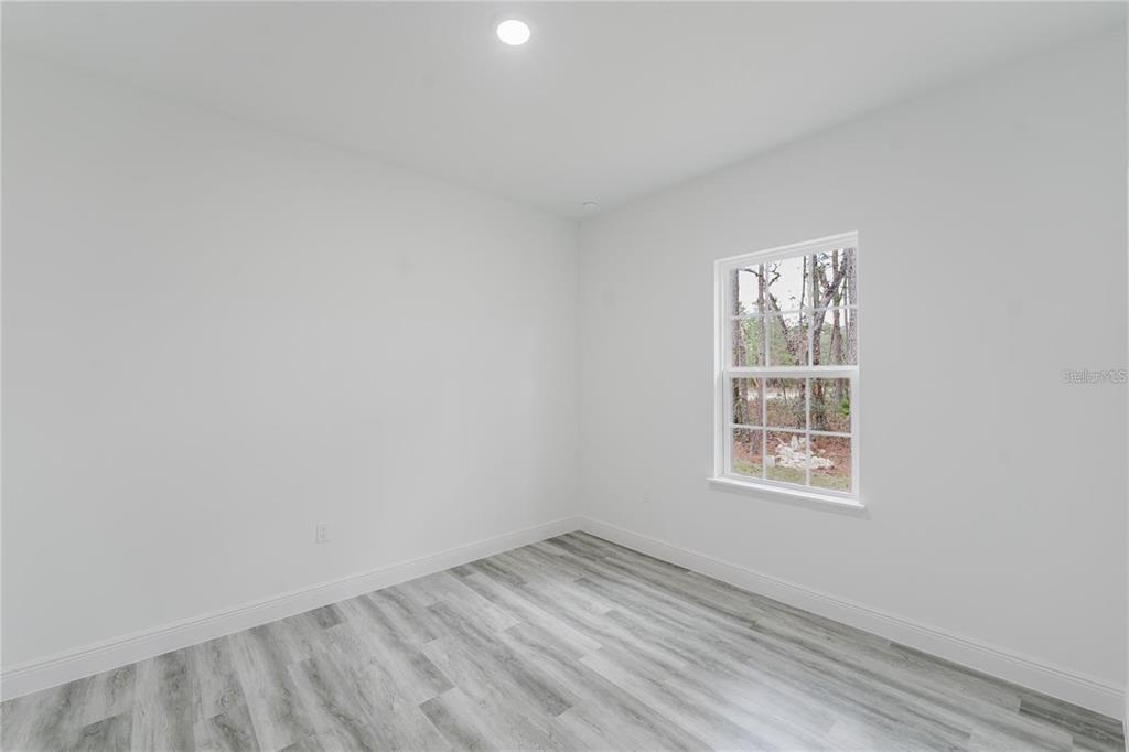 6732 Southwest 132nd Street Ocala, FL 34473 - Photo 19 of 36 an empty room with a window