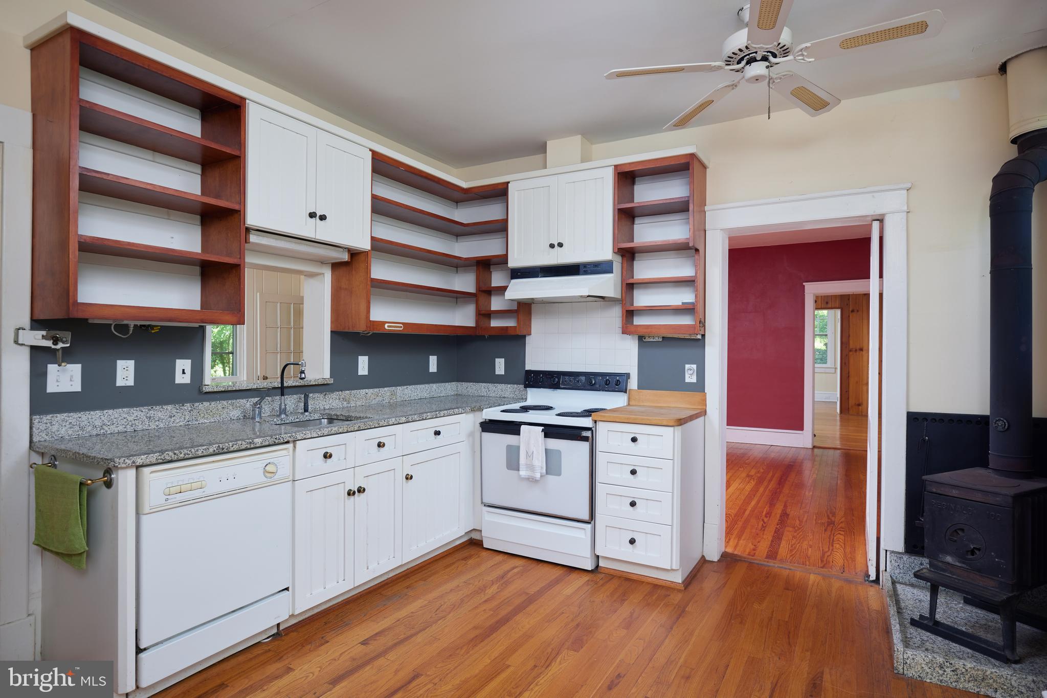 22500 Old Hundred Road Barnesville, MD 20838 - Photo 15 of 60 a kitchen with stainless steel appliances granite countertop a stove and cabinets
