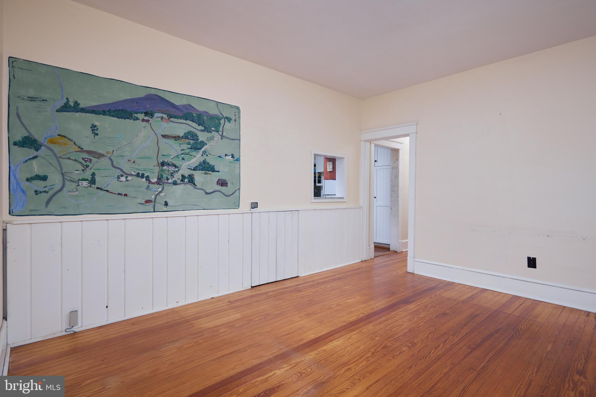 22500 Old Hundred Road Barnesville, MD 20838 - Photo 17 of 60 an empty room with painting on the wall