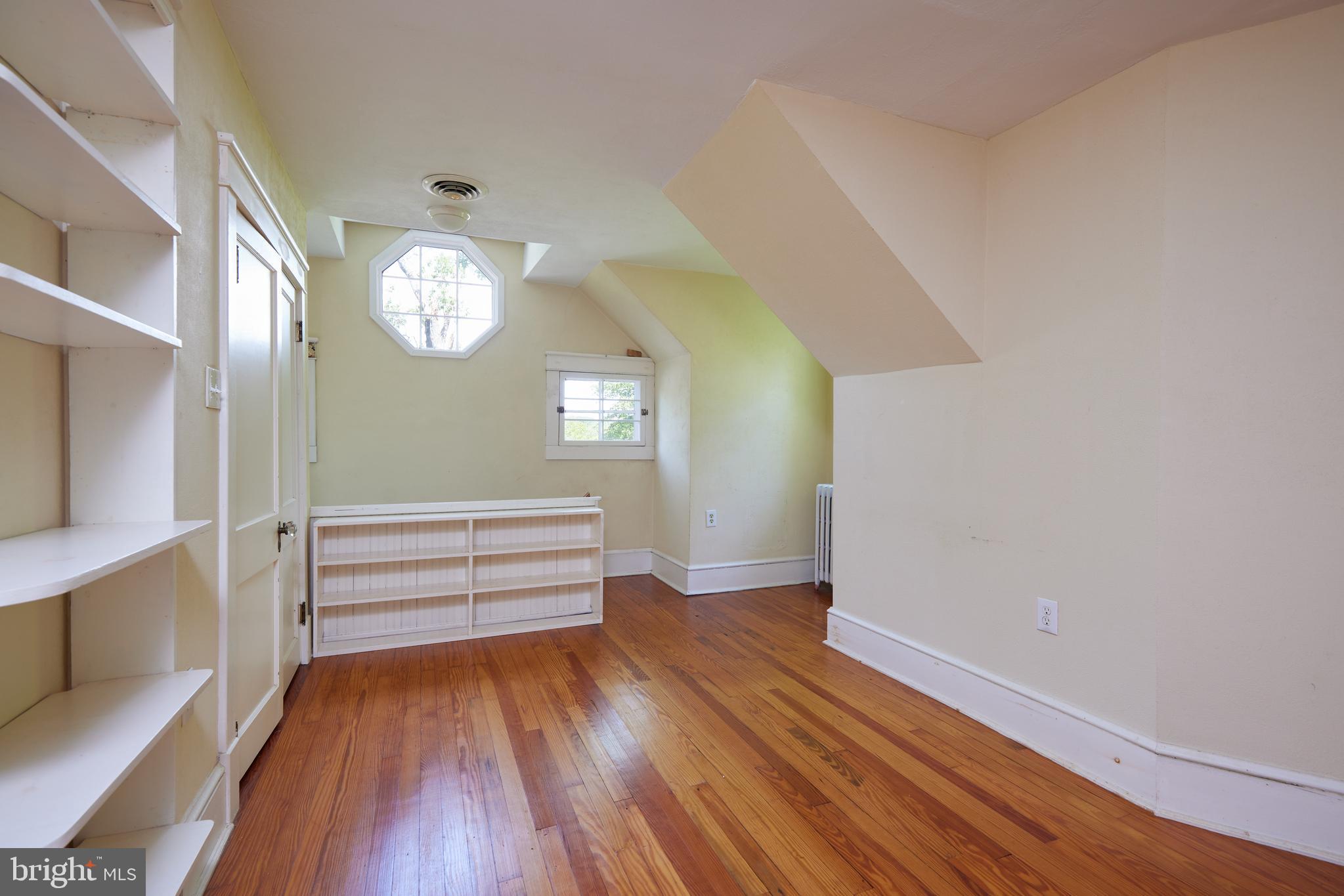 22500 Old Hundred Road Barnesville, MD 20838 - Photo 20 of 60 an empty room with wooden floor and windows