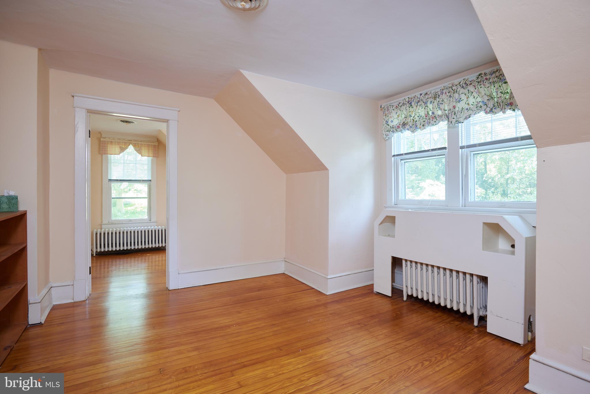 22500 Old Hundred Road Barnesville, MD 20838 - Photo 27 of 60 an empty room with wooden floor and windows
