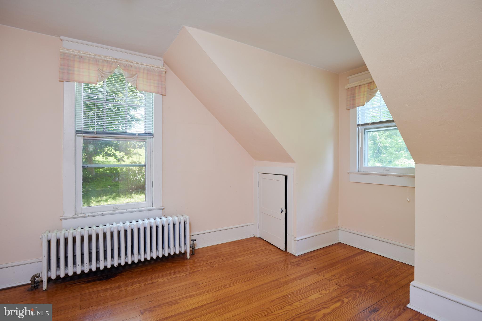22500 Old Hundred Road Barnesville, MD 20838 - Photo 28 of 60 a view of an empty room with wooden floor and a window