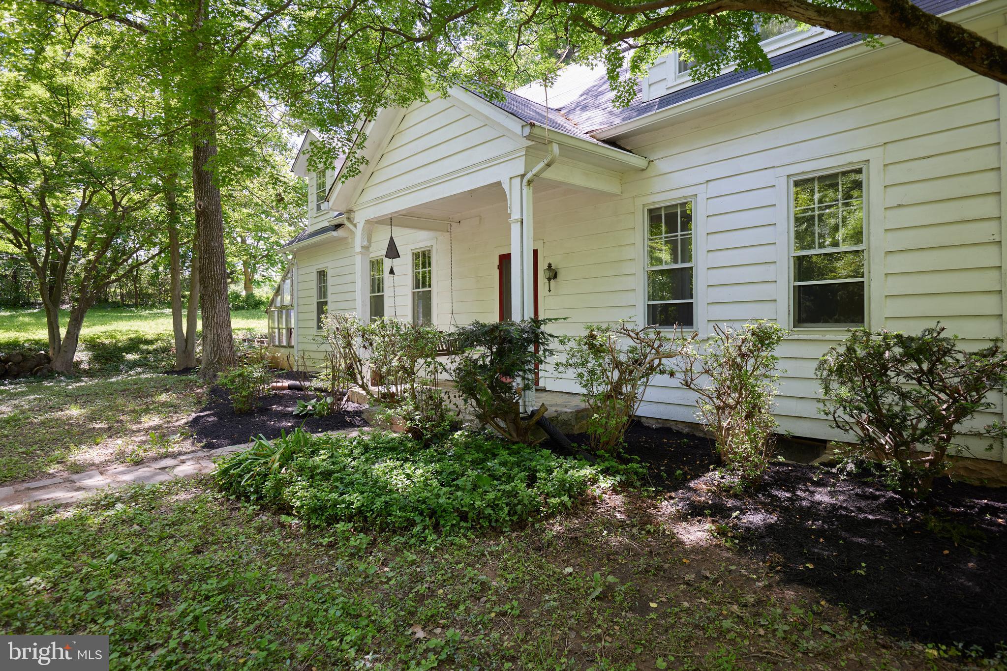 22500 Old Hundred Road Barnesville, MD 20838 - Photo 3 of 60 a front view of a house with a yard