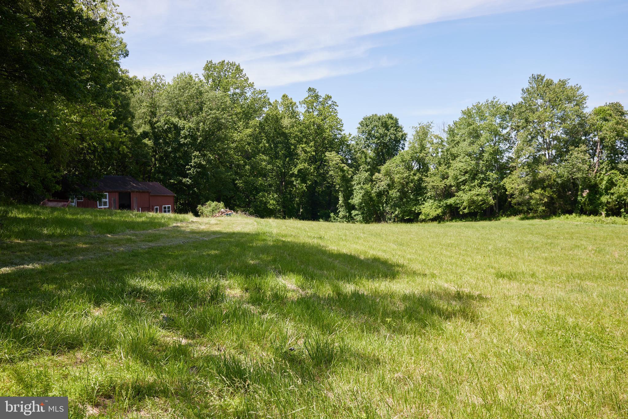 22500 Old Hundred Road Barnesville, MD 20838 - Photo 37 of 60 a view of green field with trees in the background