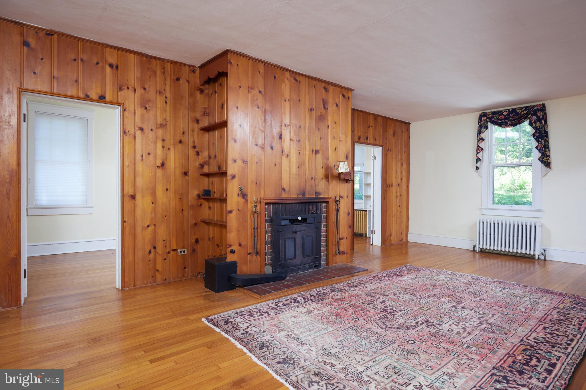22500 Old Hundred Road Barnesville, MD 20838 - Photo 8 of 60 a view of a hallway with a bedroom and wooden floor