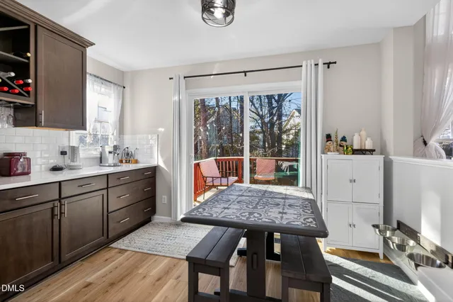 a large kitchen with stainless steel appliances granite countertop a lot of counter space and wooden floor
