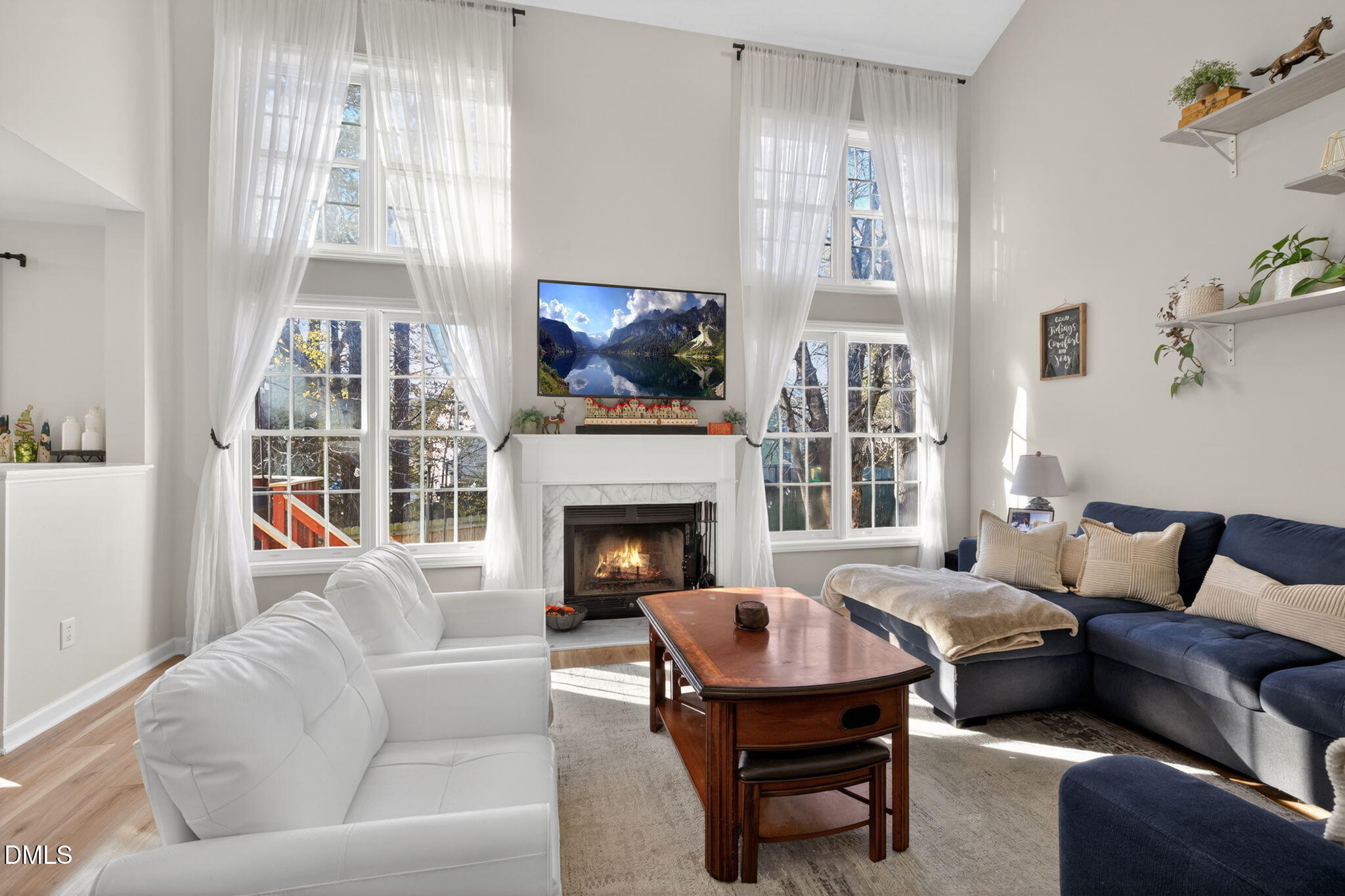 713 Marsh Grass Drive Raleigh, NC 27610 - Photo 16 of 41 a living room with furniture fireplace and window