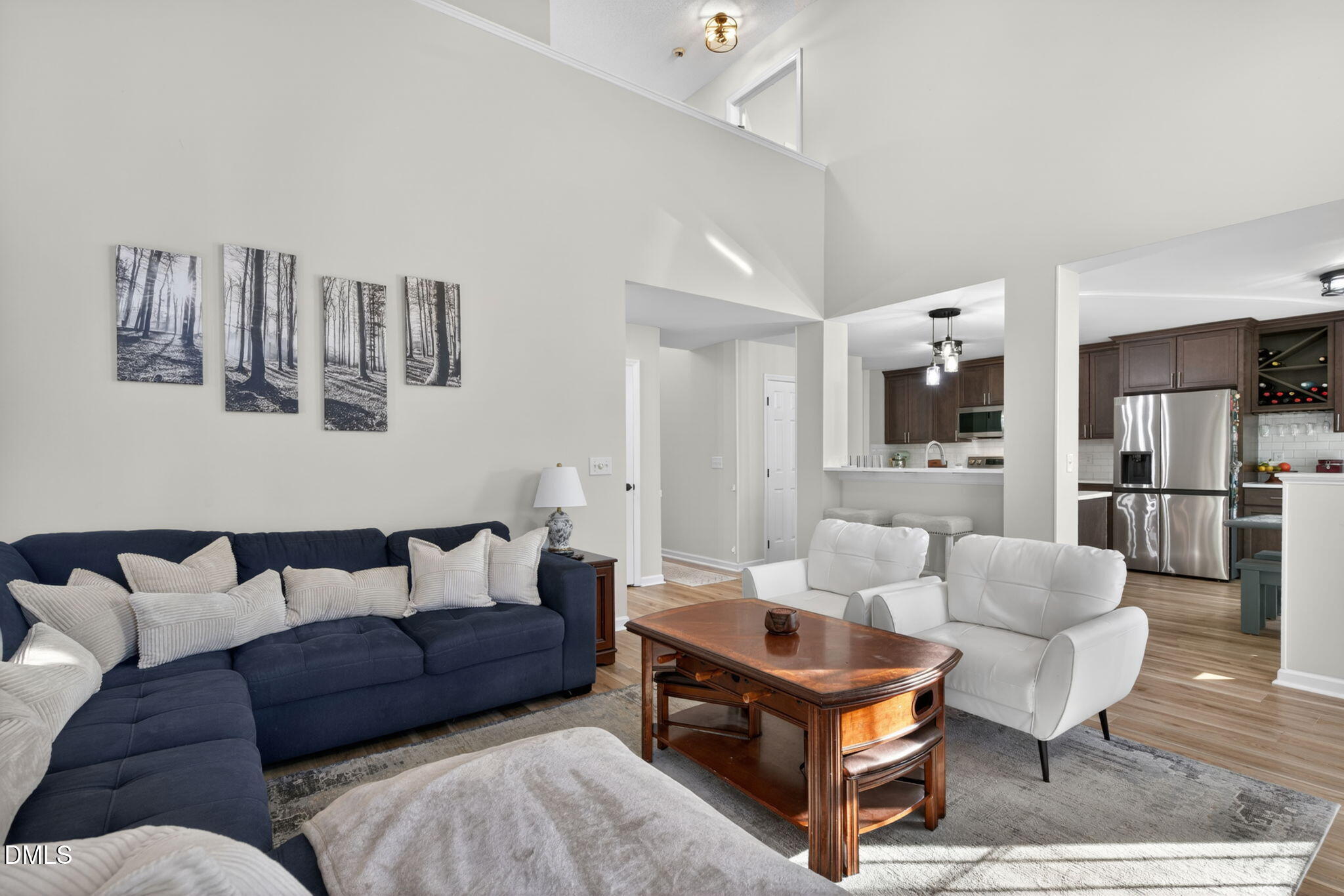 713 Marsh Grass Drive Raleigh, NC 27610 - Photo 18 of 41 a living room with furniture and kitchen view