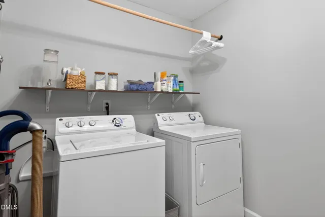a view of storage and utility room with washer and dryer