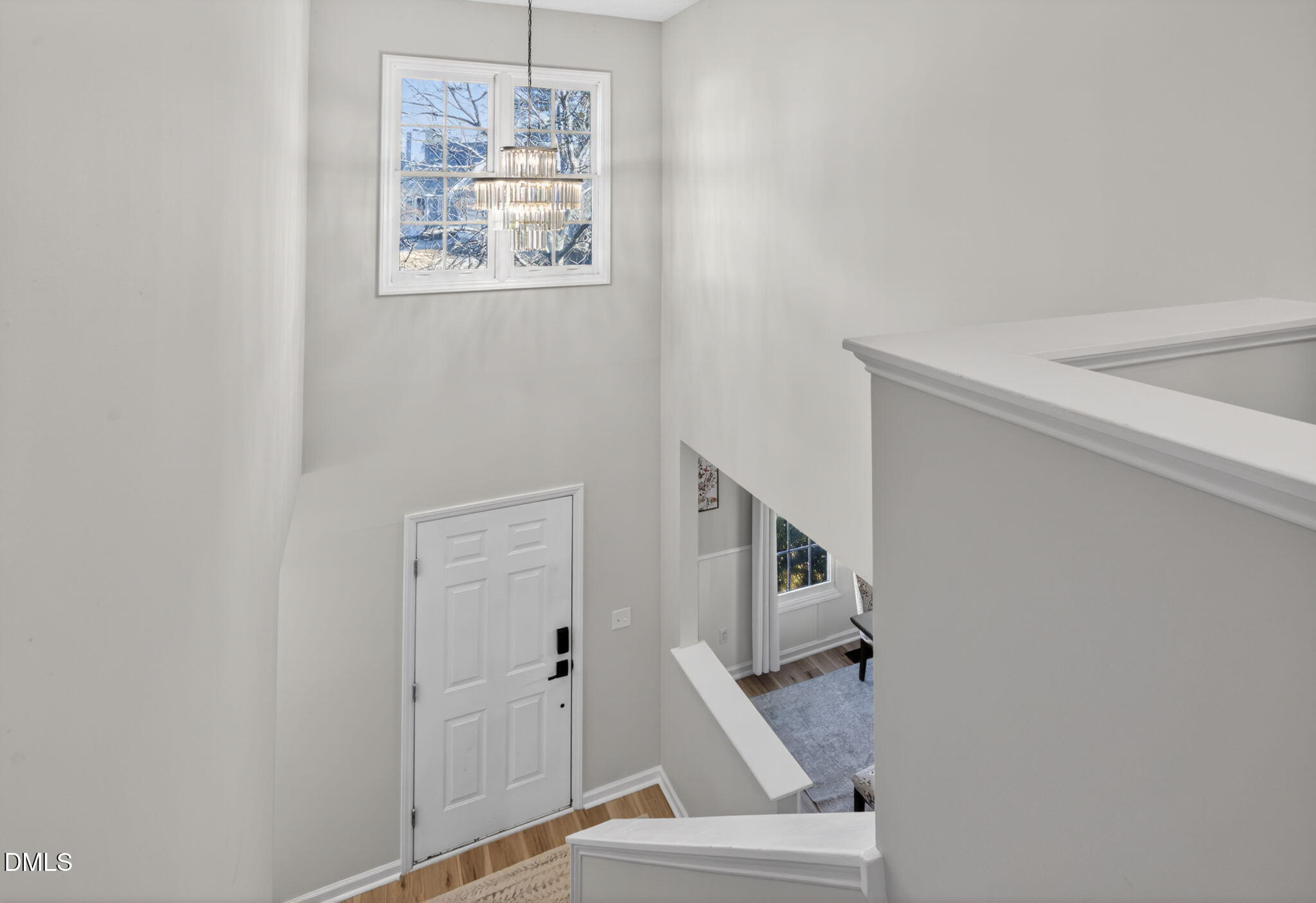 713 Marsh Grass Drive Raleigh, NC 27610 - Photo 23 of 41 a view of staircase with white walls and a window
