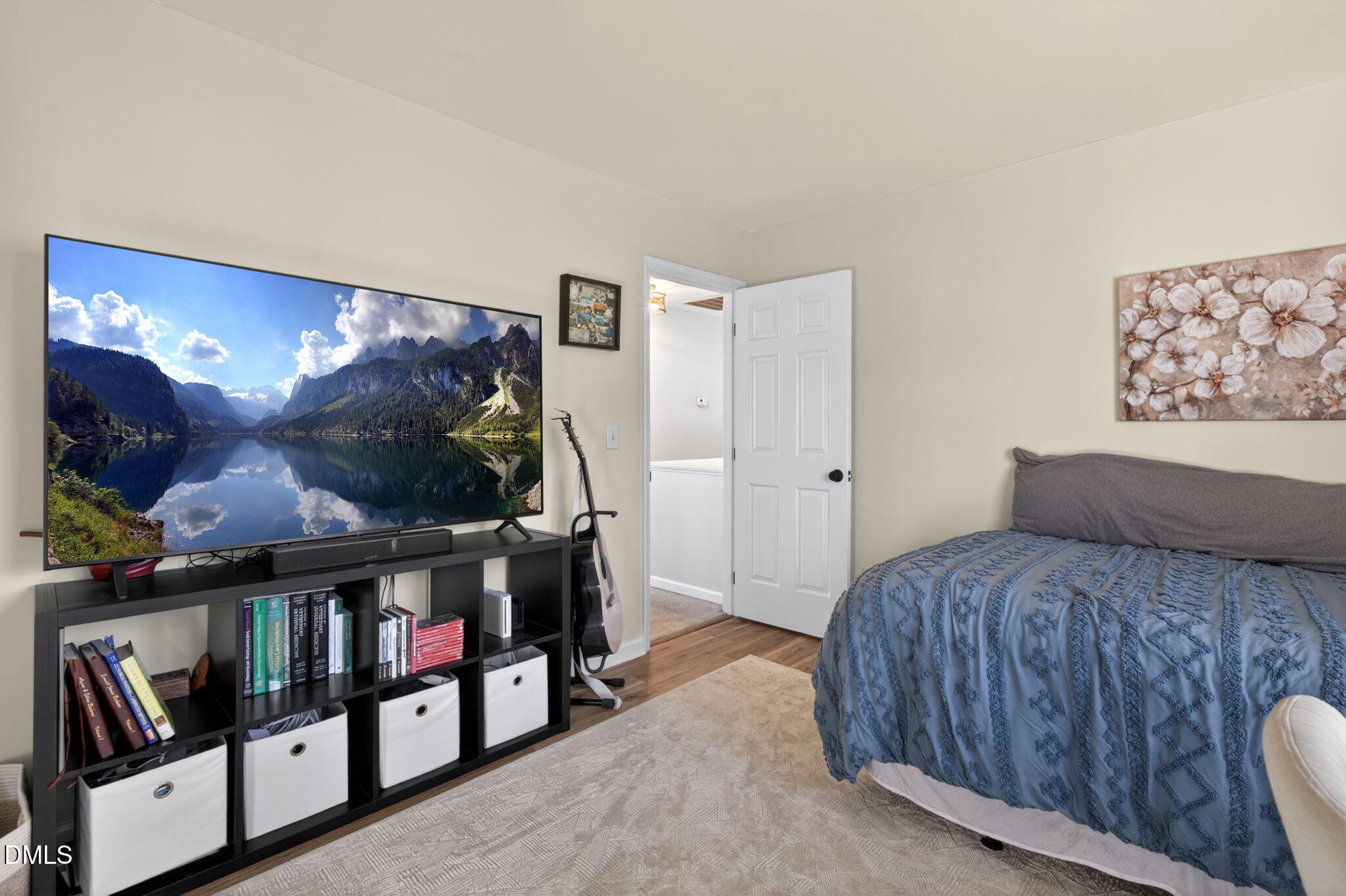 713 Marsh Grass Drive Raleigh, NC 27610 - Photo 32 of 41 a bedroom with furniture and a flat screen tv