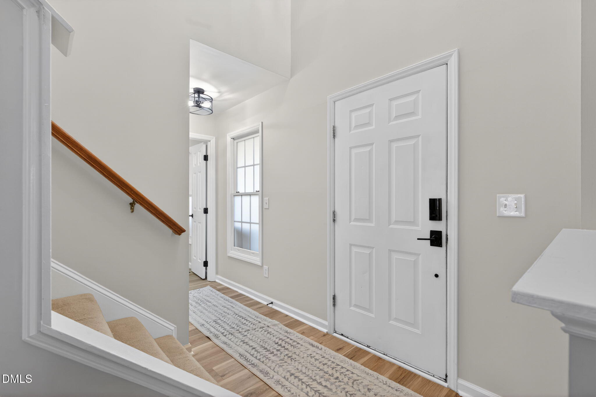 713 Marsh Grass Drive Raleigh, NC 27610 - Photo 4 of 41 a view of a hallway with front door