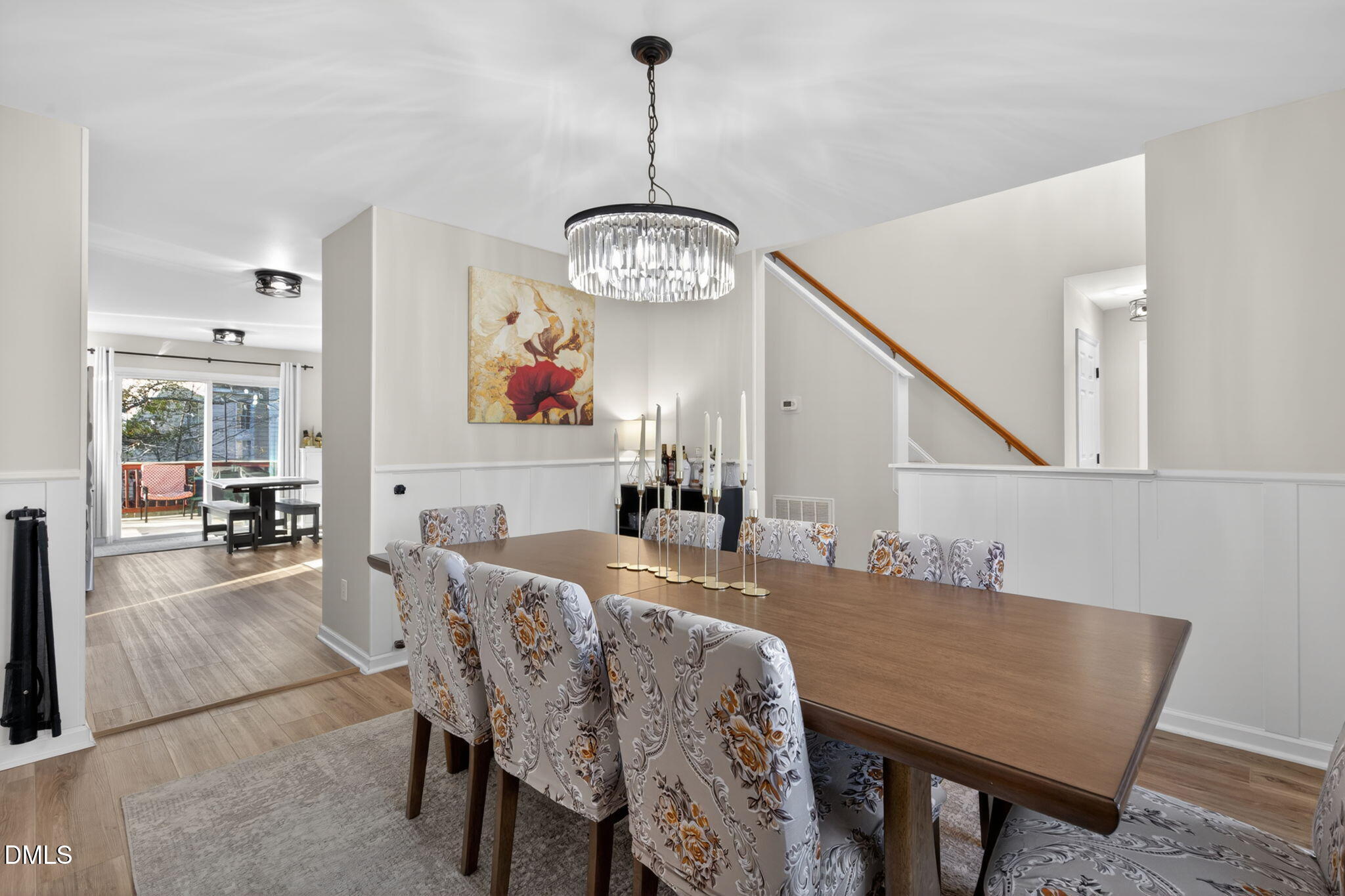 713 Marsh Grass Drive Raleigh, NC 27610 - Photo 5 of 41 a view of a dining room with furniture wooden floor and a chandelier