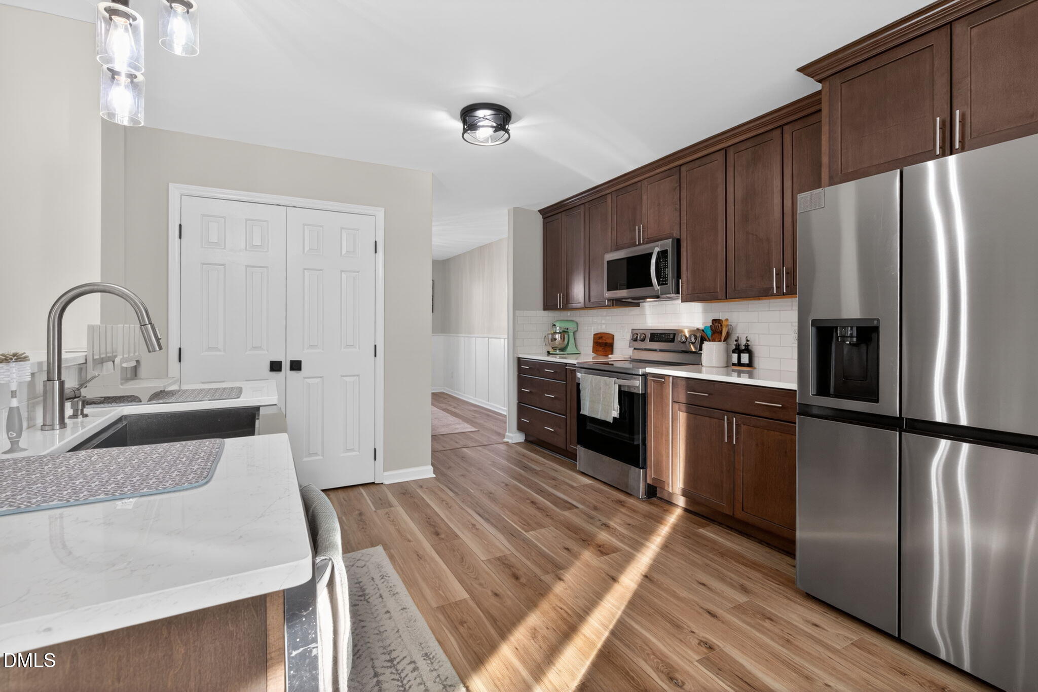 713 Marsh Grass Drive Raleigh, NC 27610 - Photo 8 of 41 a kitchen with granite countertop a refrigerator stove and sink