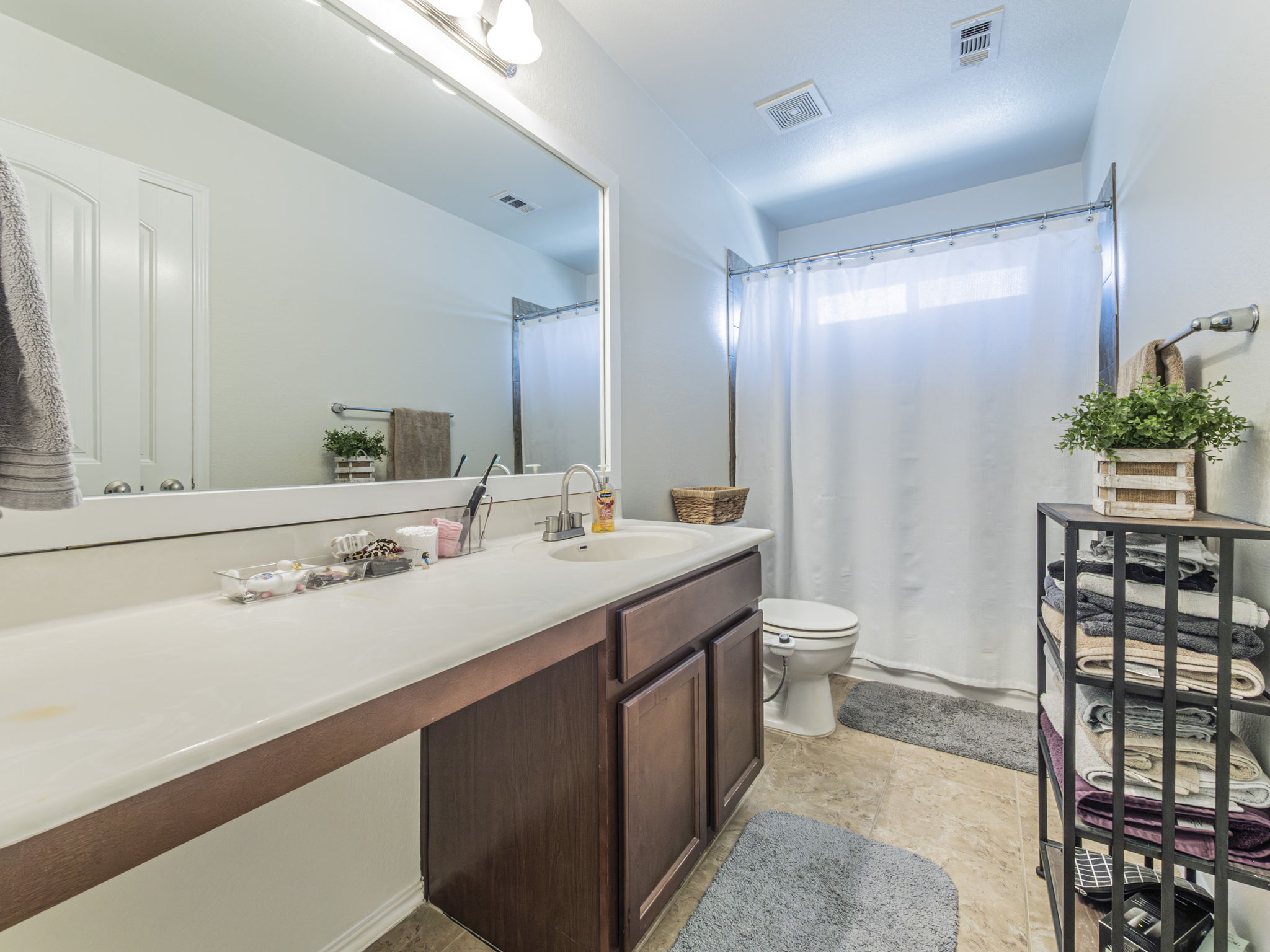 1366 Heep Run Buda, TX 78610 - Photo 19 of 37 Full hall bath featuring vanity and a shower with curtain