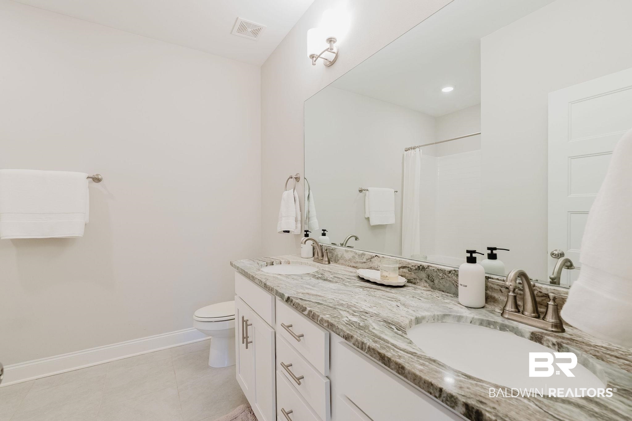 7872 Calverton Street Foley, AL 36535 - Photo 45 of 76 Double vanity with integrated sinks and a stone-finish countertop