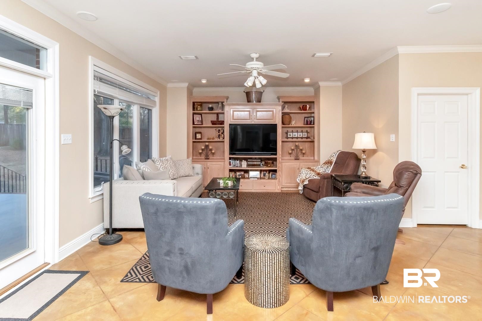 1050 Southern Way Court Mobile, AL 36609 - Photo 10 of 36 Living room featuring ornamental molding, plenty of natural light, and light tile patterned floors