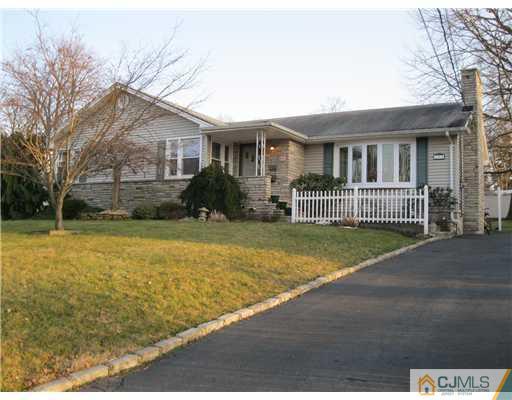 153 Oxford Road Colonia, NJ 07067 - Photo 1 of 13 a front view of a house with garden