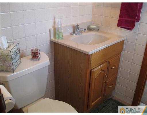 153 Oxford Road Colonia, NJ 07067 - Photo 11 of 13 a bathroom with a sink toilet and shower