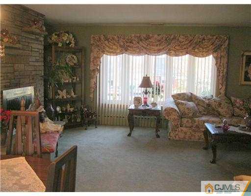 153 Oxford Road Colonia, NJ 07067 - Photo 13 of 13 a living room with furniture and a large window