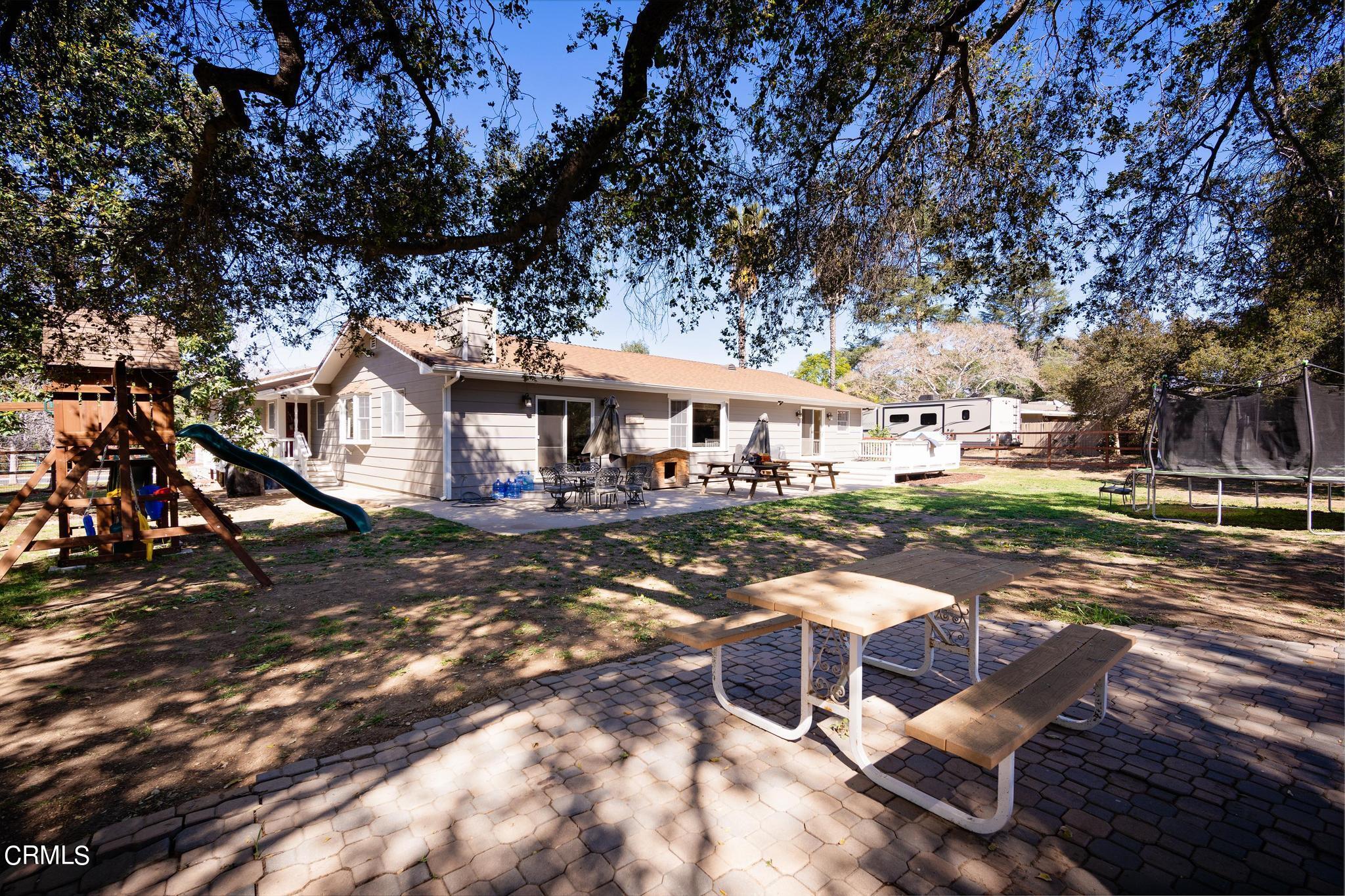 1138 Spring Street Oak View, CA 93022 - Photo 33 of 38 a patio with a yard table and chairs