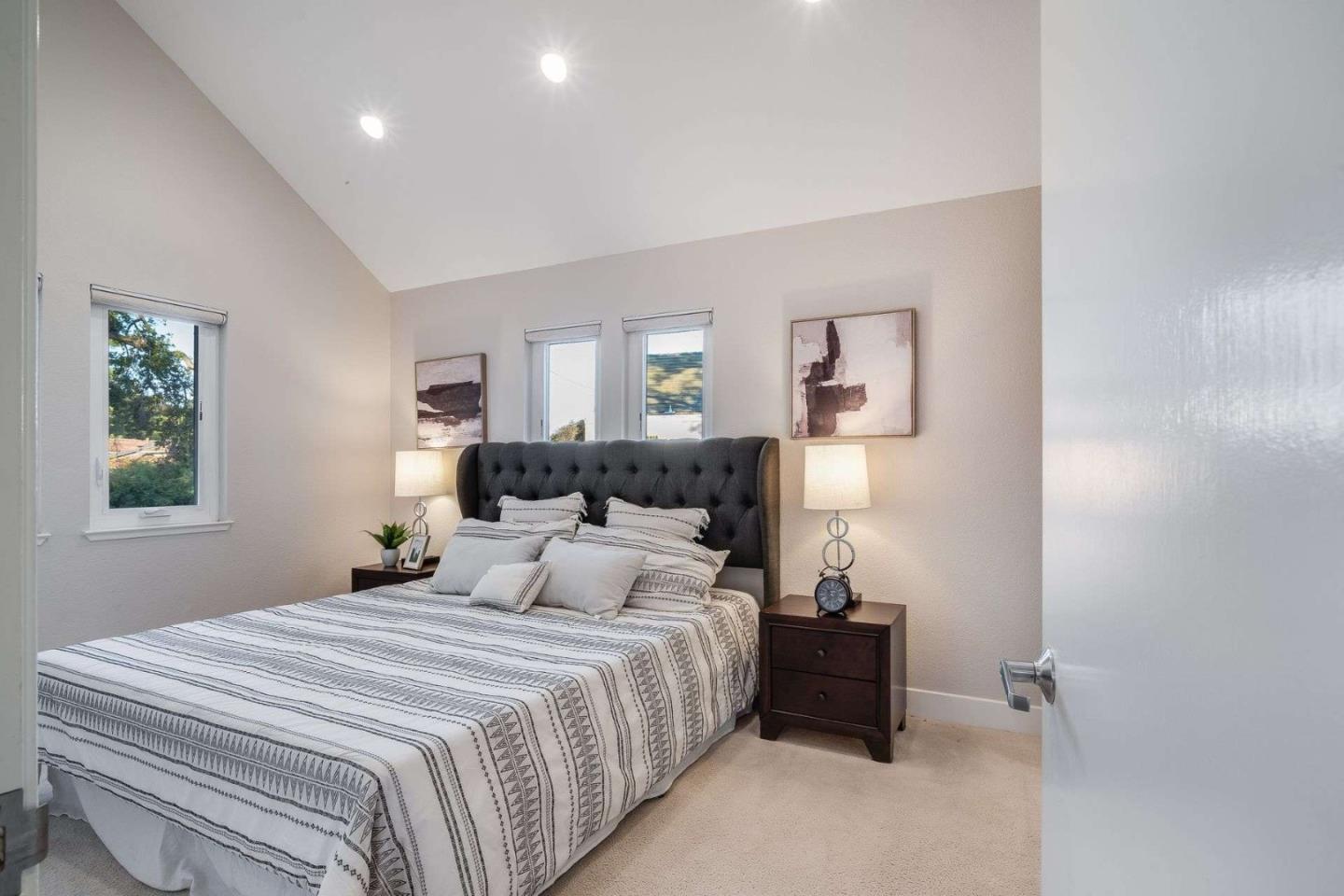 181 Centre Street, Unit 1 Mountain View, CA 94041 - Photo 16 of 58 a bedroom with a bed and a night stand